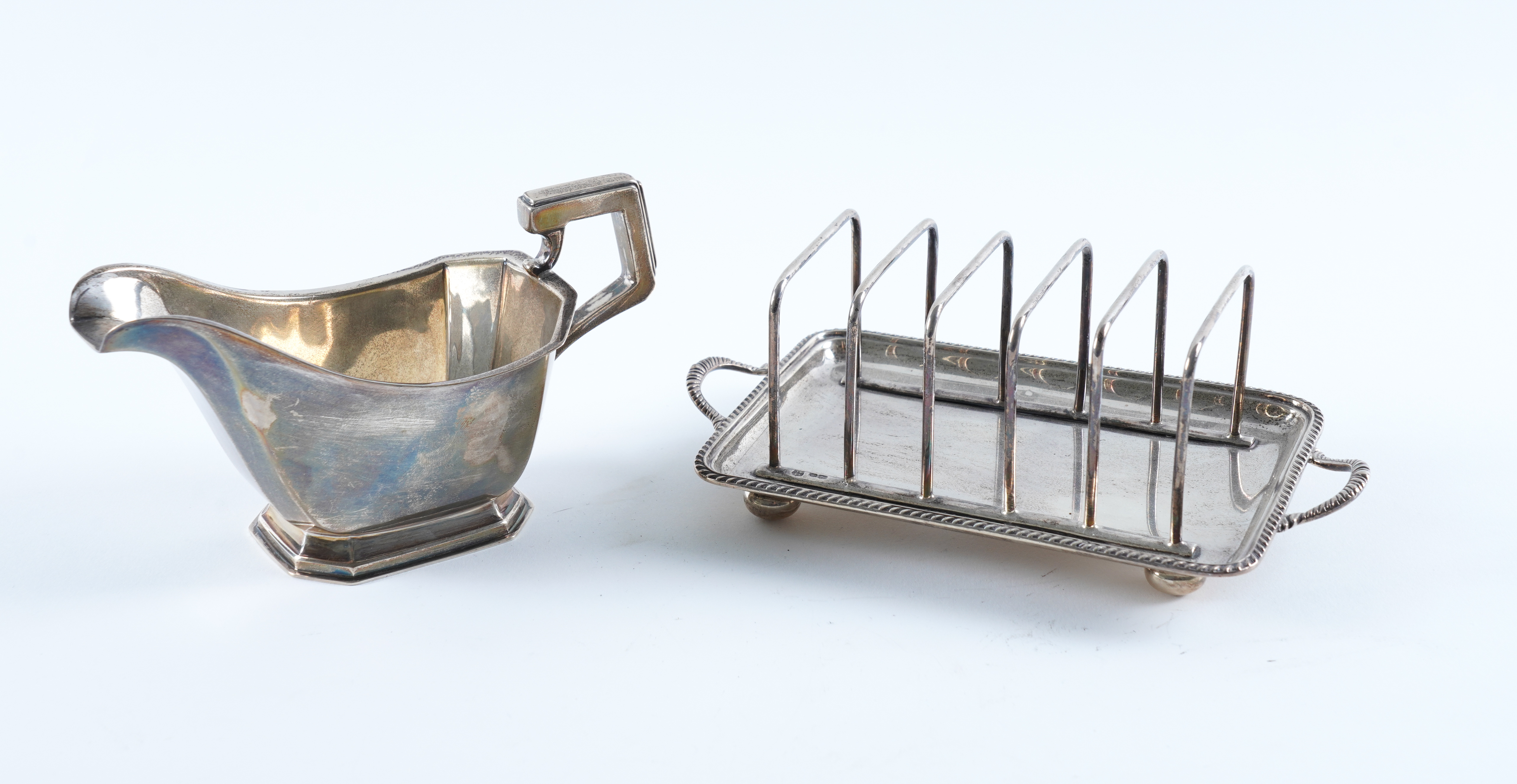 A SILVER TOASTRACK AND A SILVER