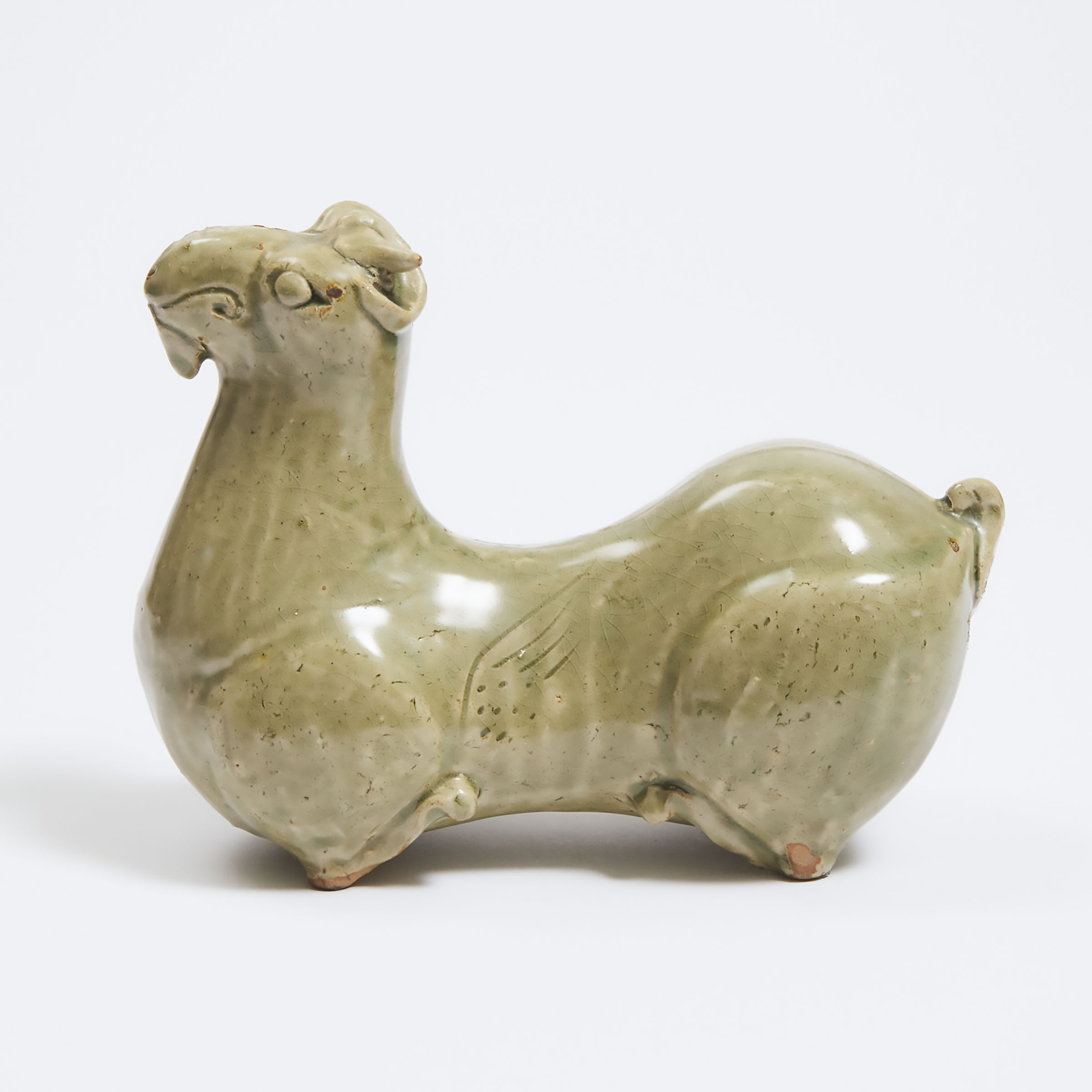 A Celadon Glazed Recumbent Ram  3ac1b6