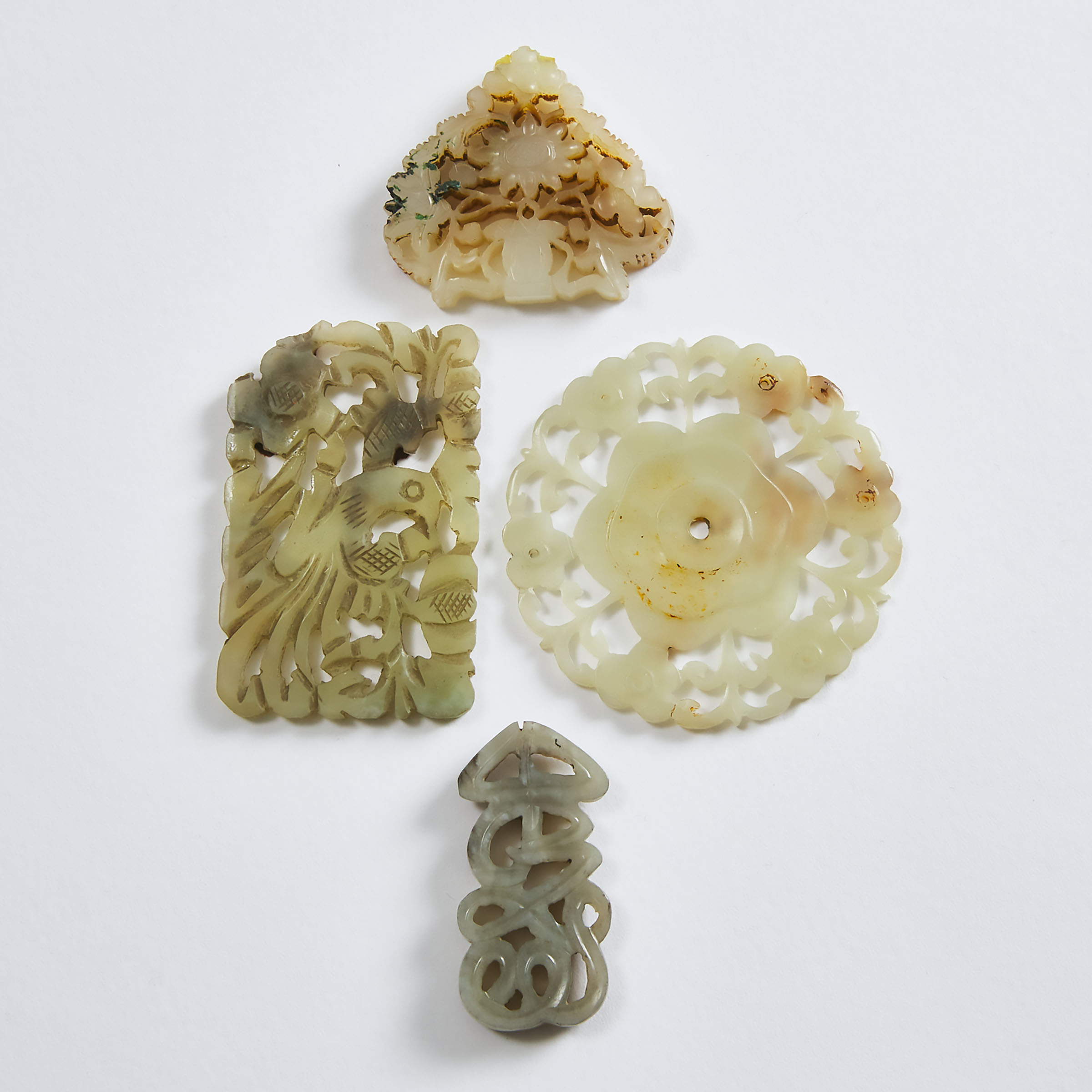 A Group of Four Carved White Jade