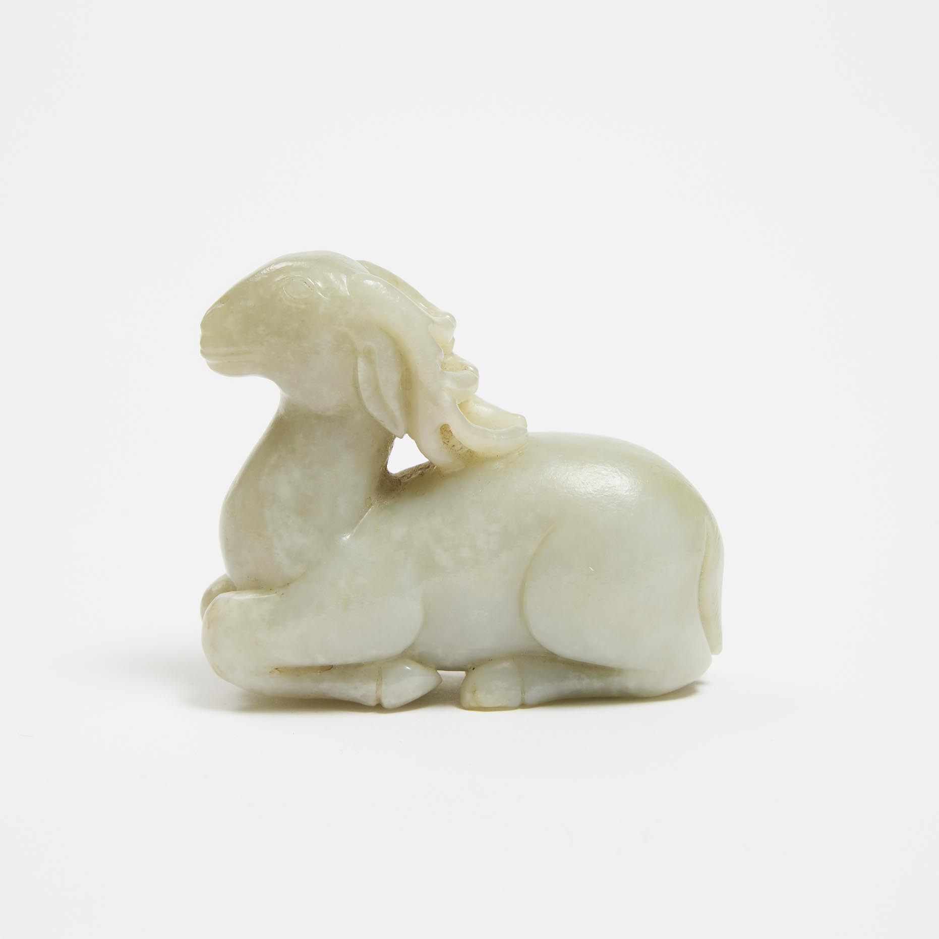 A Pale Celadon Jade Recumbent Ram,