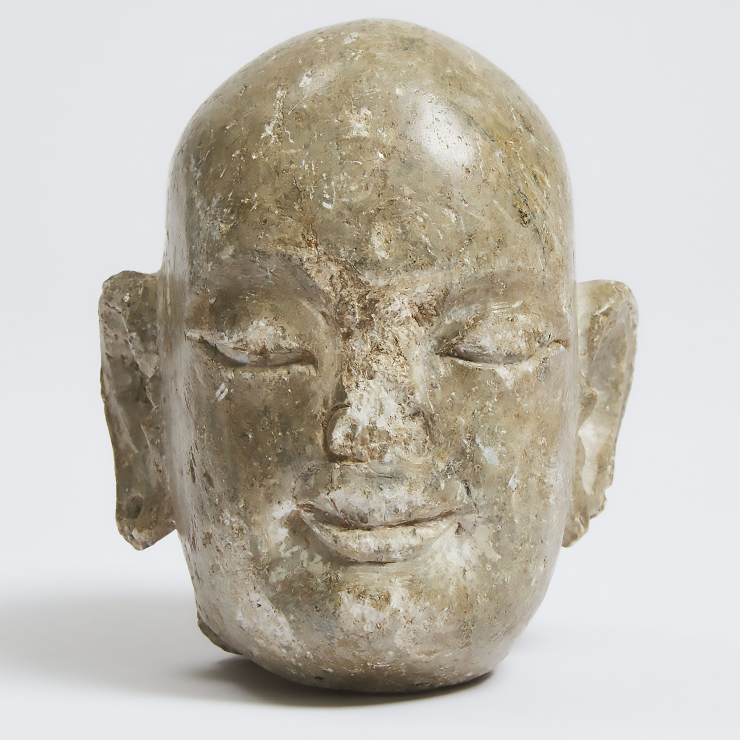 A Tang-Style Carved Limestone Head