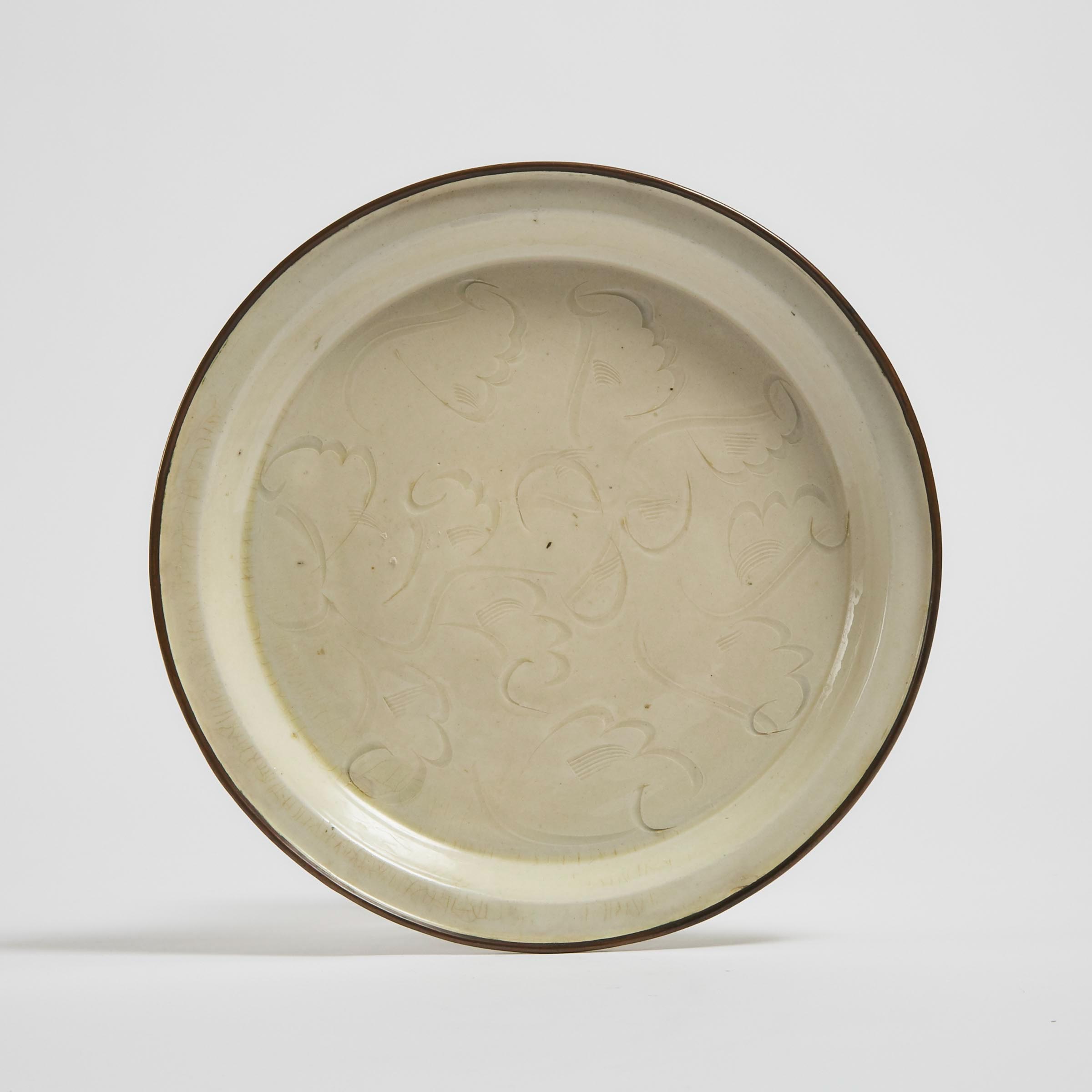 A Rare and Finely Carved Ding Dish,