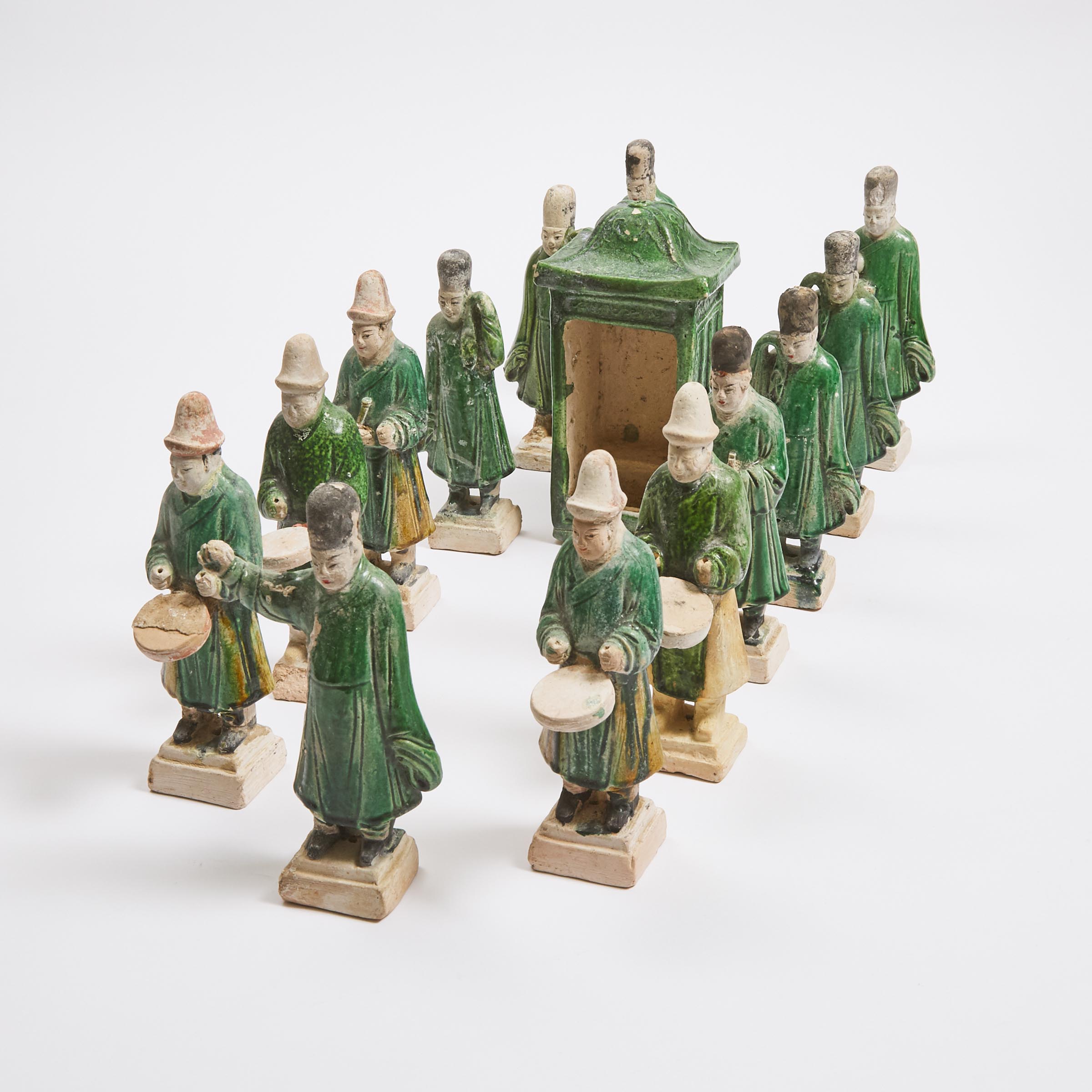 A Group of Thirteen Green-Glazed