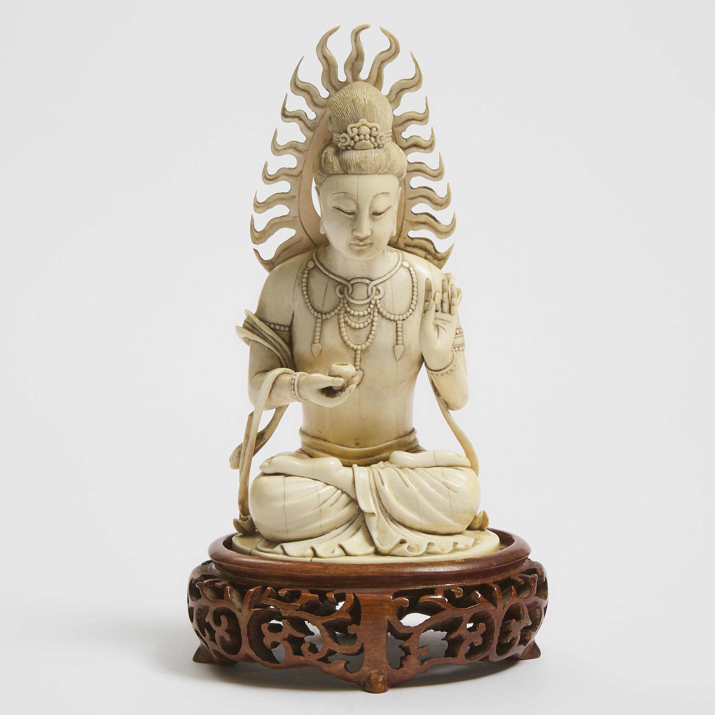 An Ivory Figure of a Seated Bodhisattva,