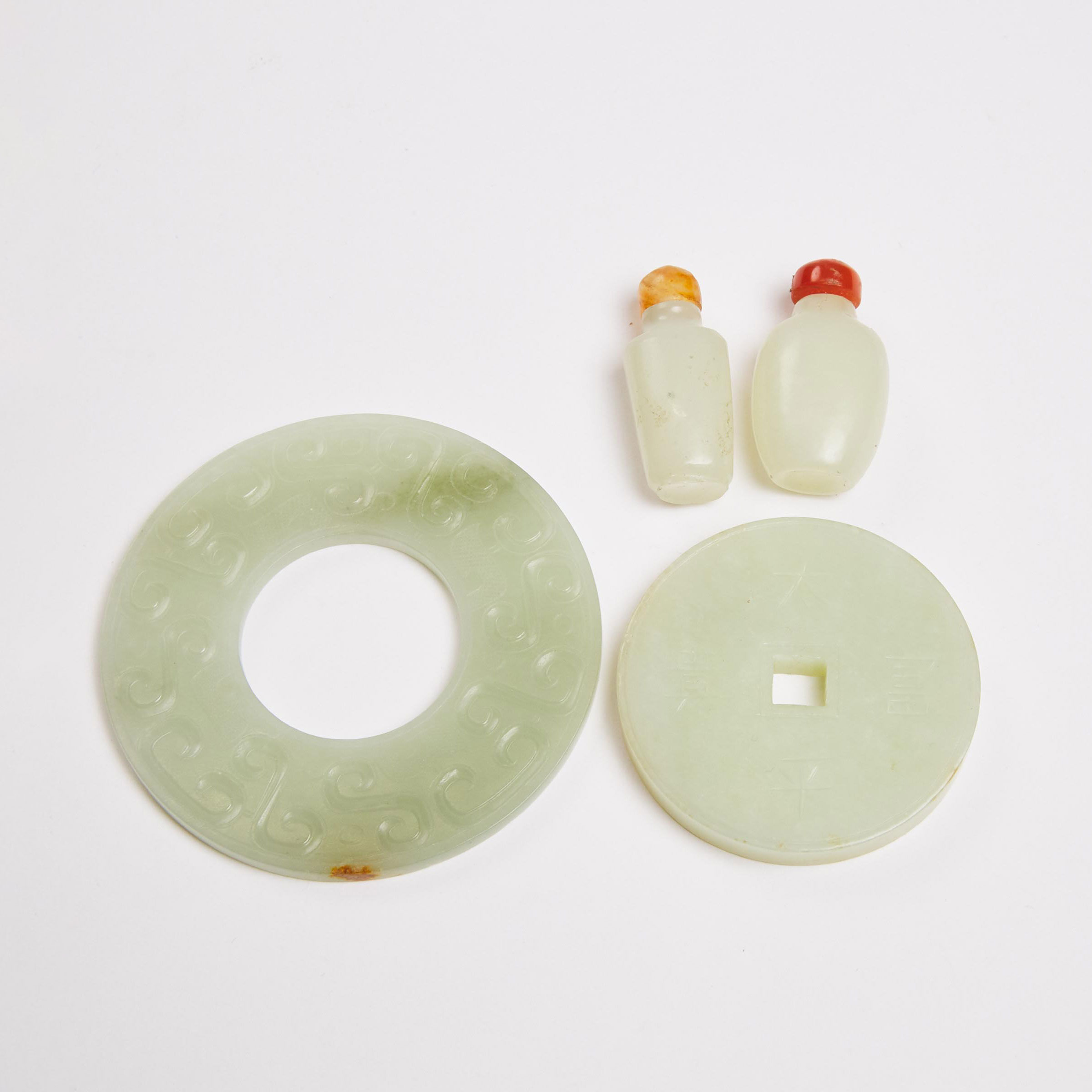 A Group of Four White Jade Items,