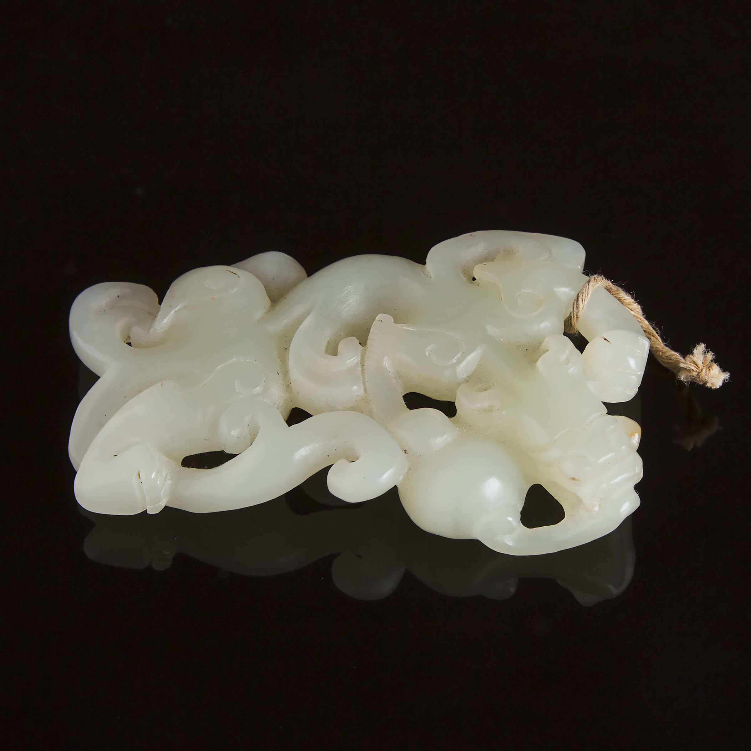 A Carved White Jade Archaistic