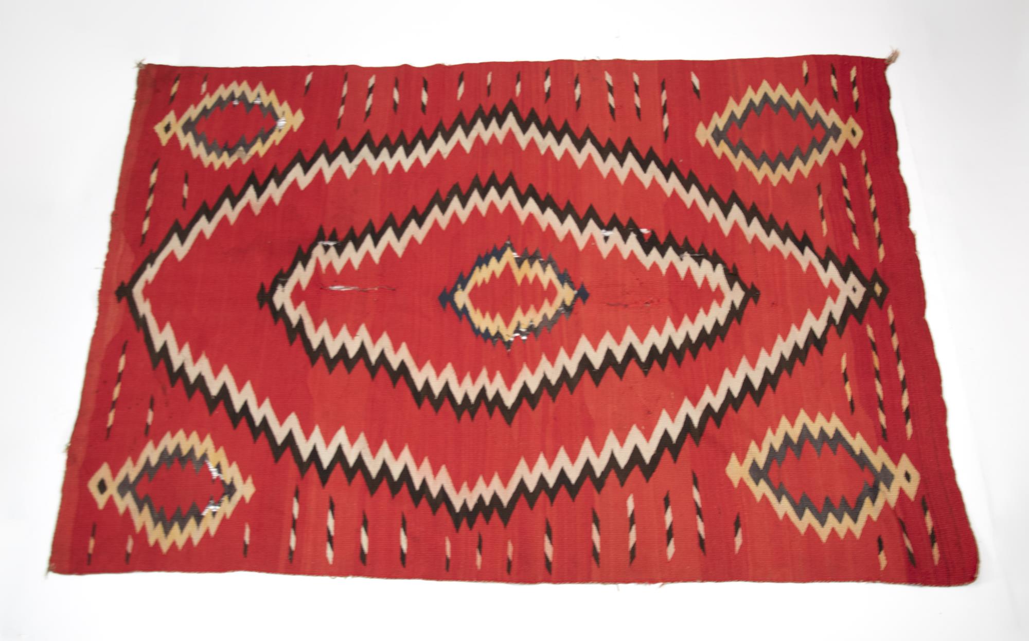 19TH C. NAVAJO RUG. Red ground