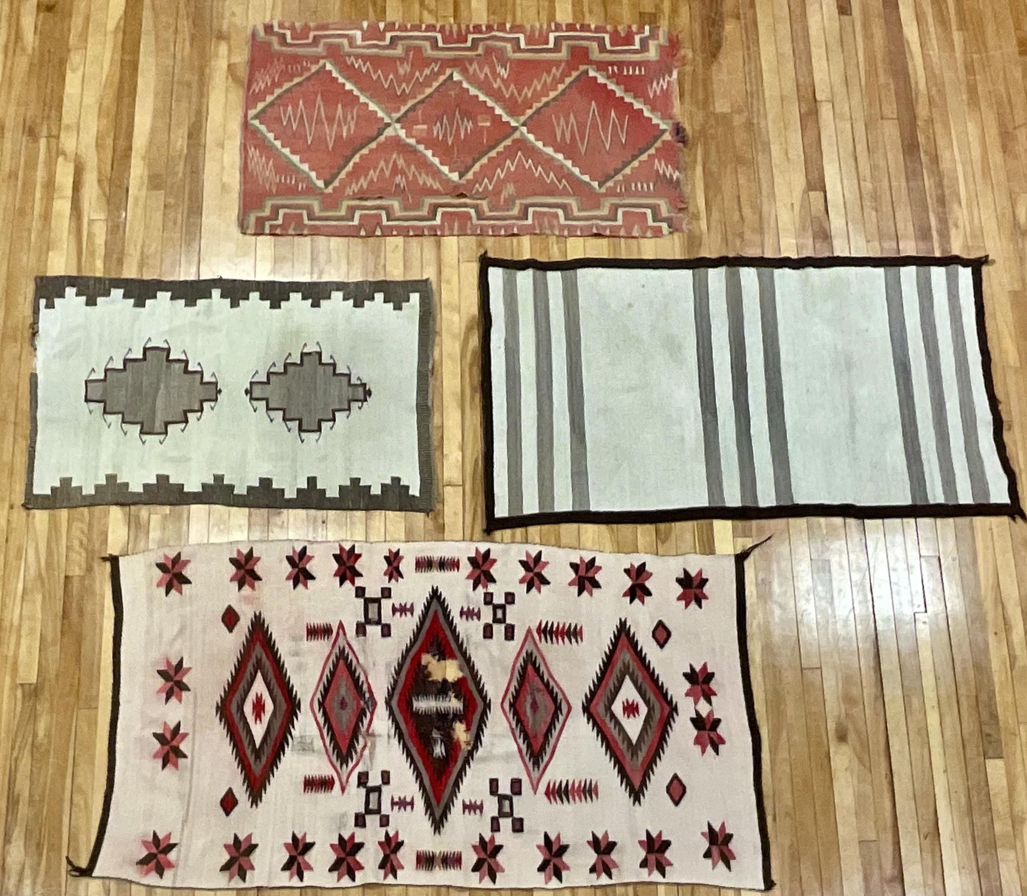 FOUR NAVAJO RUGS. Four geometric