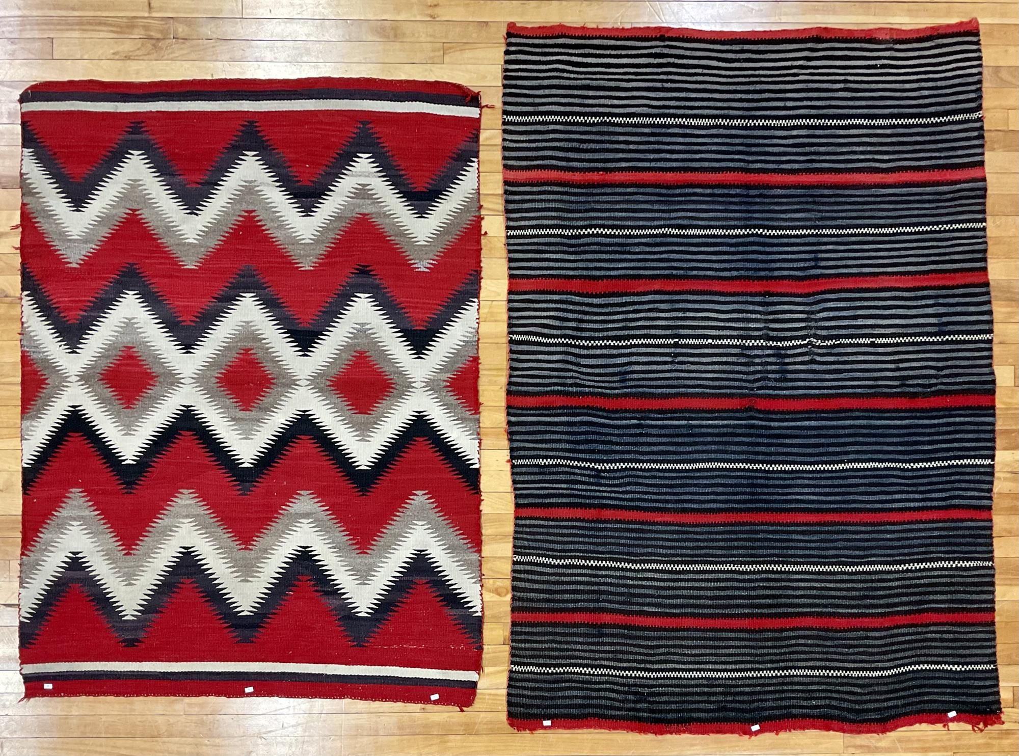 TWO COLORFUL NAVAJO RUGS. One red