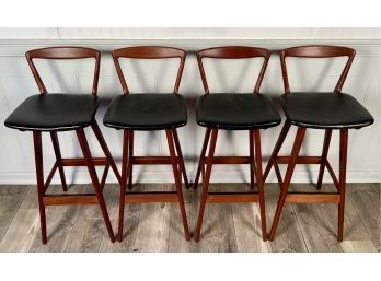 A set of four teak barstool with black