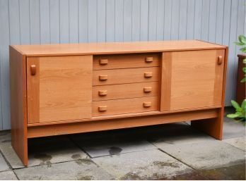 One of a pair of teak sideboards