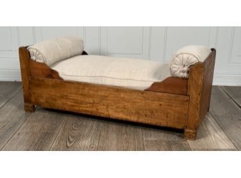An antique pine dog bed with a 3acea3