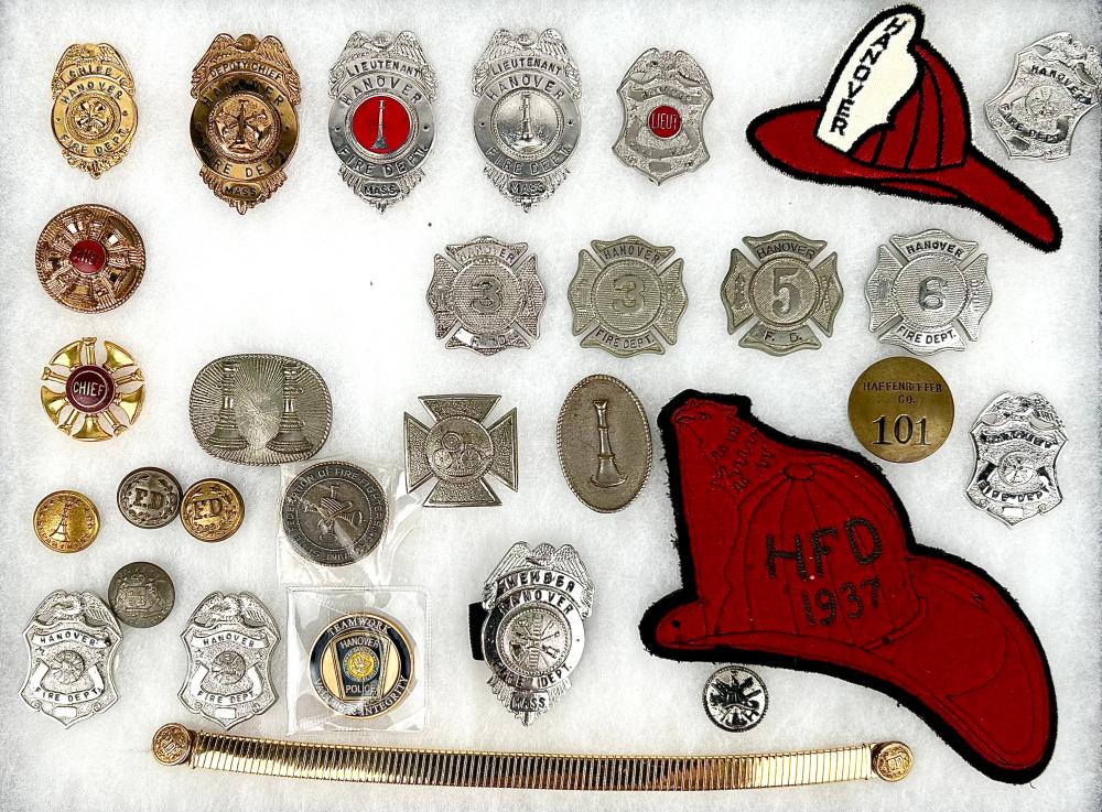 CASED COLLECTION OF FIRE BADGES,