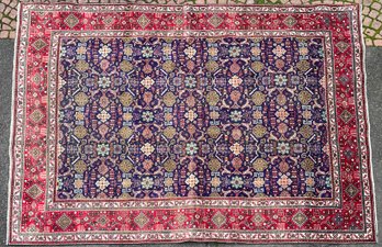 A vintage Oriental room size rug,