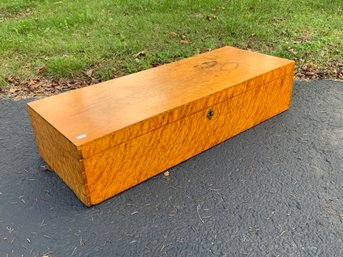 An antique solid birdseye maple