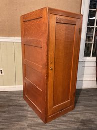 A ca. 1900 oak single door cabinet,