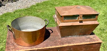 A large antique dovetailed copper pot