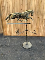 A vintage galloping horse weathervane