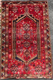 A vintage Oriental area rug, with