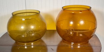 Two similar amber glass globes 3b013d