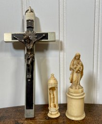 An antique silver cross with wood