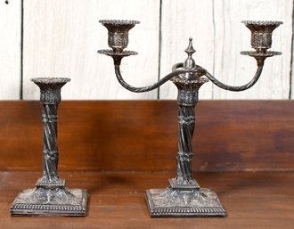 A pair of English silver candlesticks