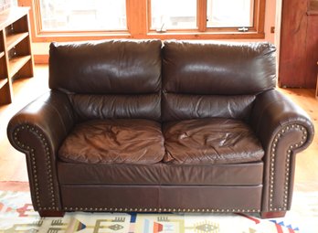 A contemporary brown leather love