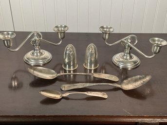 A pair of sterling weighted candelabras