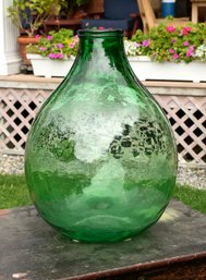 A ca. 1900 molded and blown demijohn