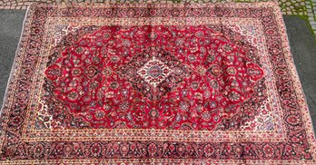 A vintage room size Oriental rug,