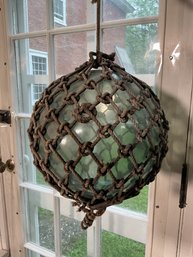 A vintage light green blown glass