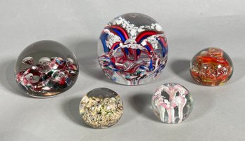 Five vintage glass paperweights, unsigned,