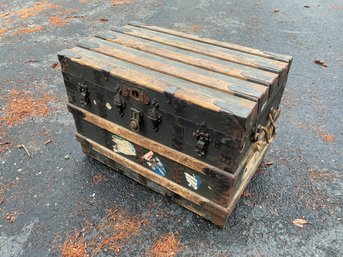 An antique flat top steamer trunk, with