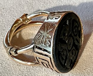 A 14 K gold ring with a carved 3b029b