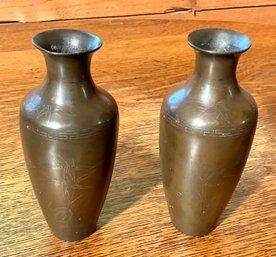 A pair of antique Asian bronze
