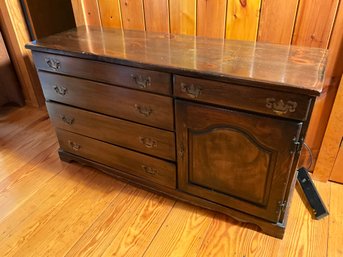 A vintage pine dresser with five exposed