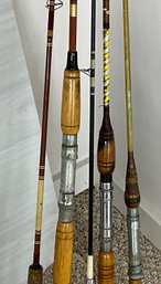 Five fishing poles, no reels. 