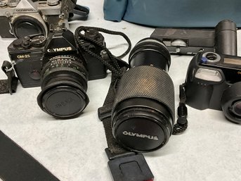 Three Olympus cameras plus accessories  3b030e