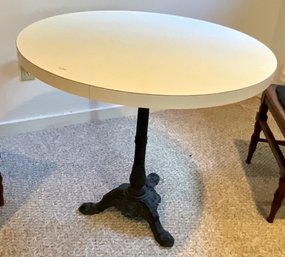 A round cafe table with an iron 3b0311