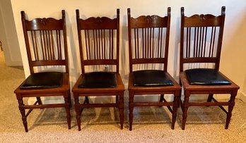 A set of four antique oak chairs, with