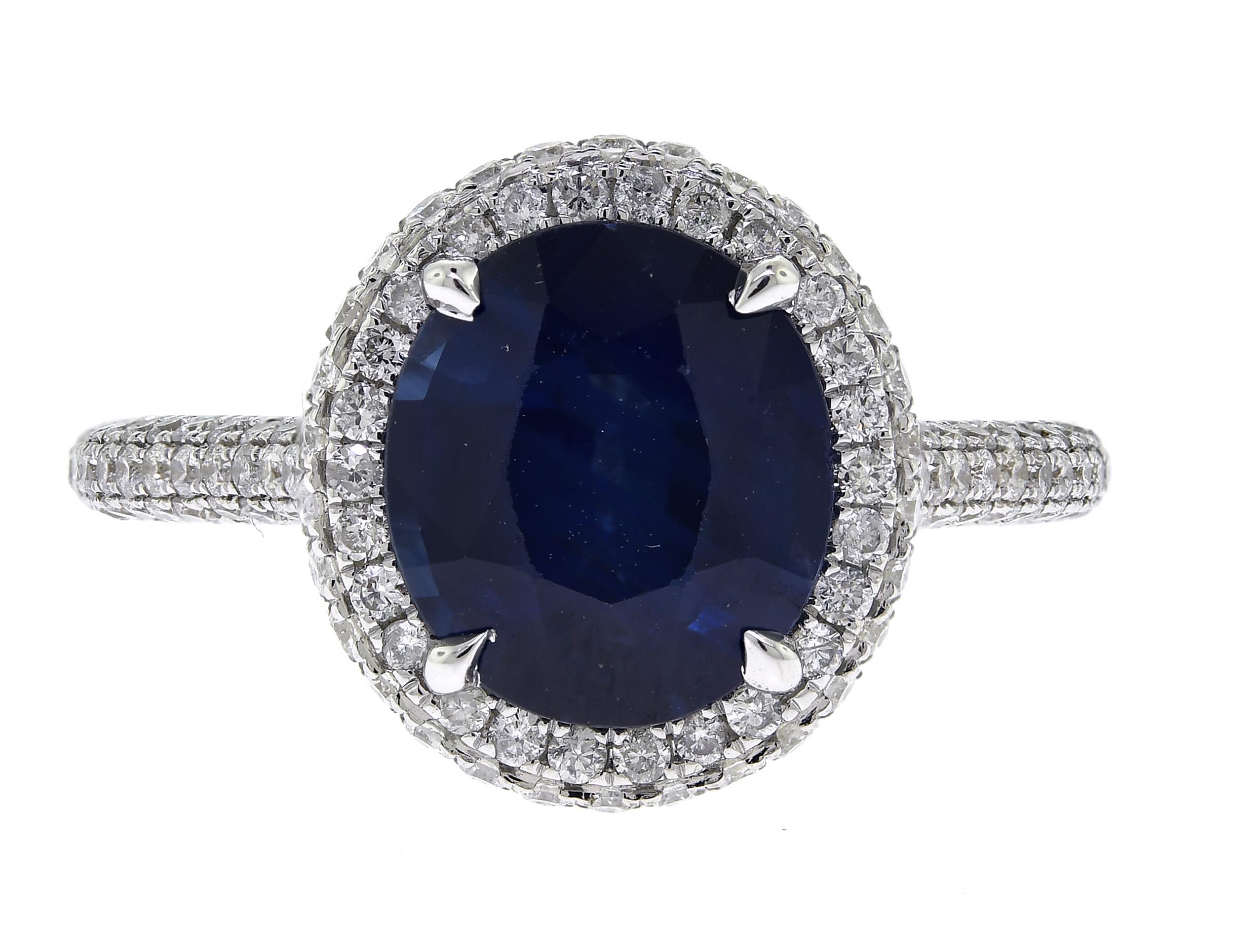 18K GOLD SAPPHIRE AND DIAMOND RING.