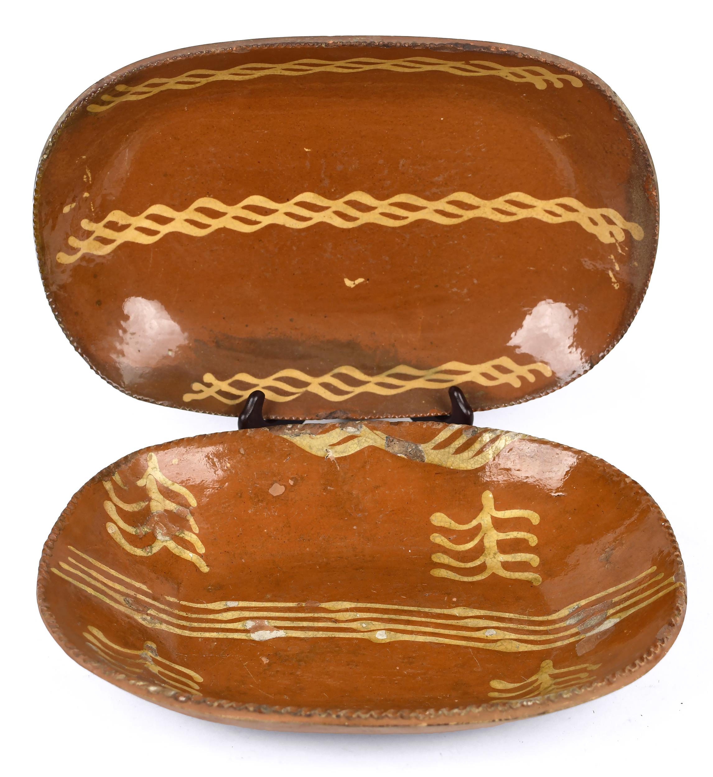 TWO 19TH C. PA REDWARE LOAF DISHES.