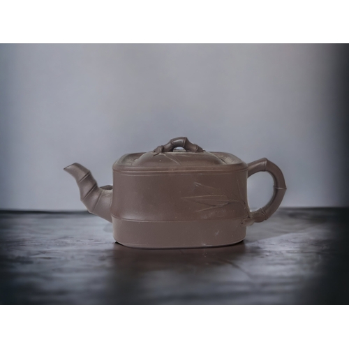 A CHINESE YIXING CLAY TEAPOT. WITH