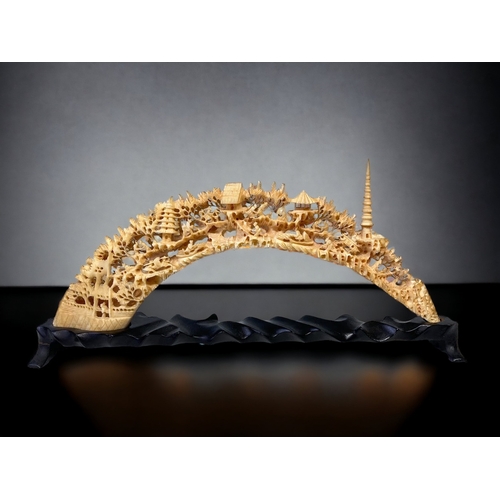 A CHINESE CARVED HIPPO TOOTH BRIDGE.