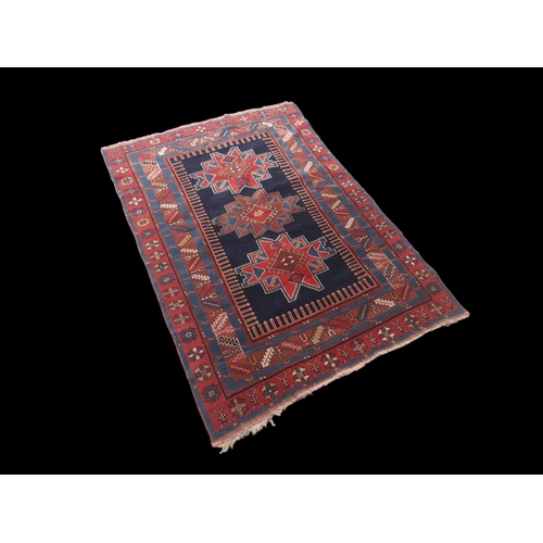 A MOGHAN KAZAK POLYCHROME RUG  3b060c