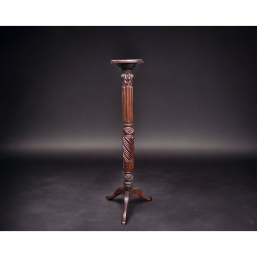 A VICTORIAN TRIPOD CARVED TORCHERE STAND.