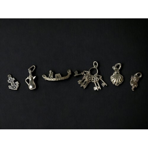 6 Vintage silver charms.