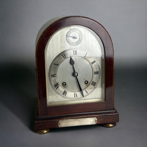 A MAHOGANY CASED MANTLE CLOCK.