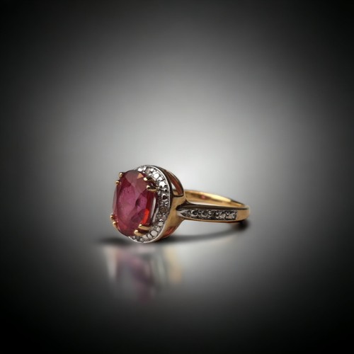 A 9ct gold ladies Ruby halo design