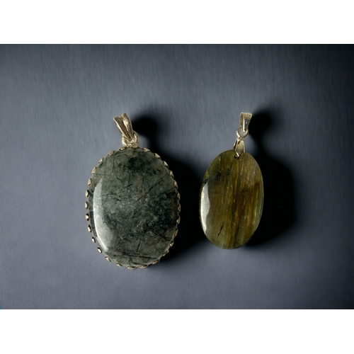 TWO LADIES POLISHED AGATE PENDANTS.